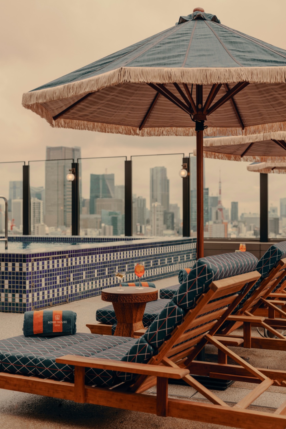 Sun loungers by rooftop pool | soho house tokyo