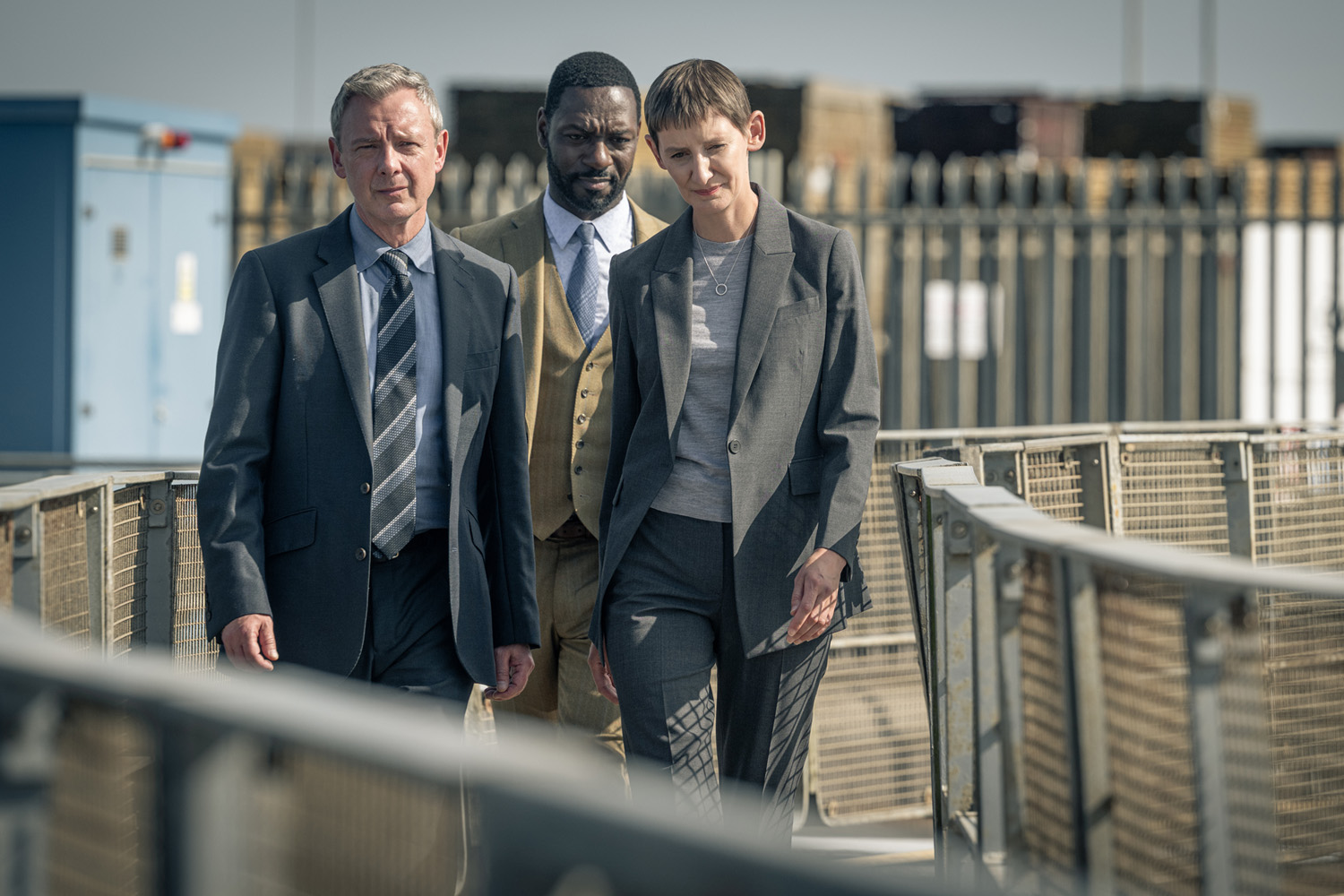 JOHN SIMM as DS Roy Grace, RICHIE CAMPBELL as DS Branson and LAURA ELPHINSTONE as DS Bella Moy in Grace series 6.