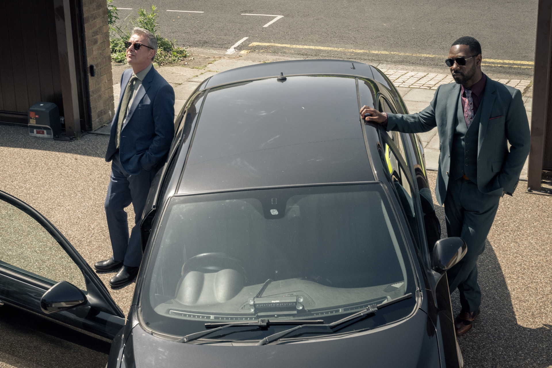 JOHN SIMM as DS Roy Grace and RICHIE CAMPBELL as DS Branson in Grace series 6.