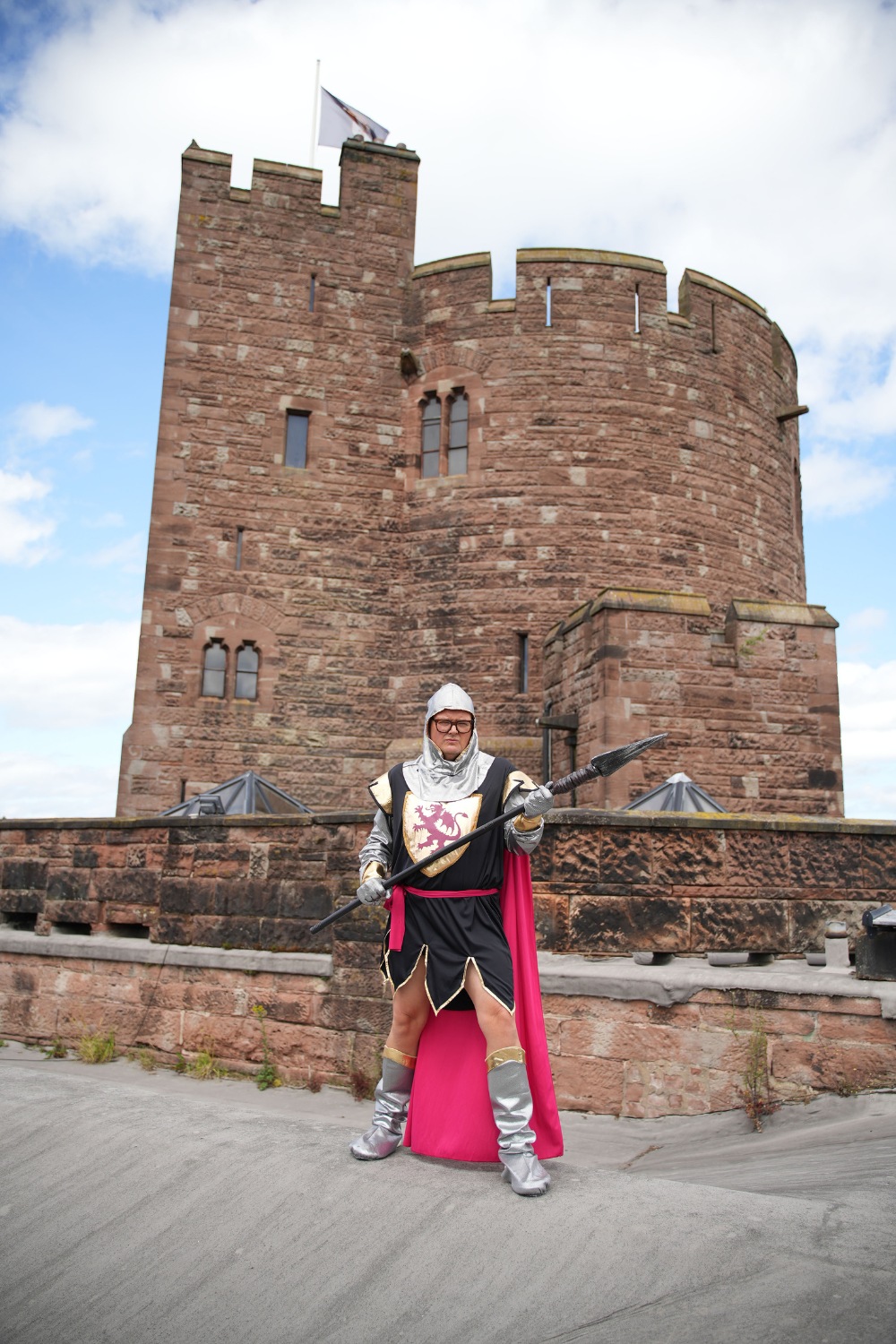 Alan Carr in front of castle
