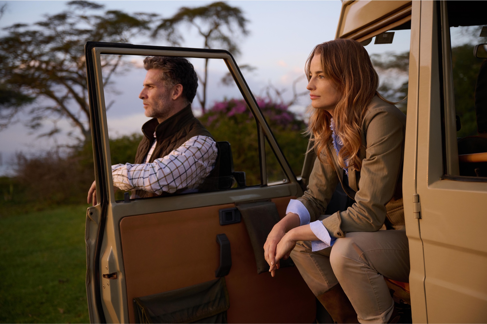 Man and woman sat together in jeep