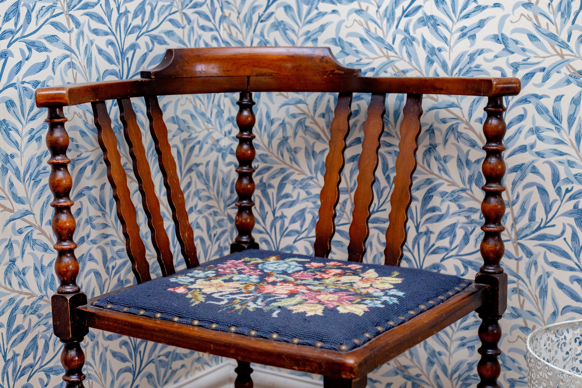 Wooden chair with embroidered seat