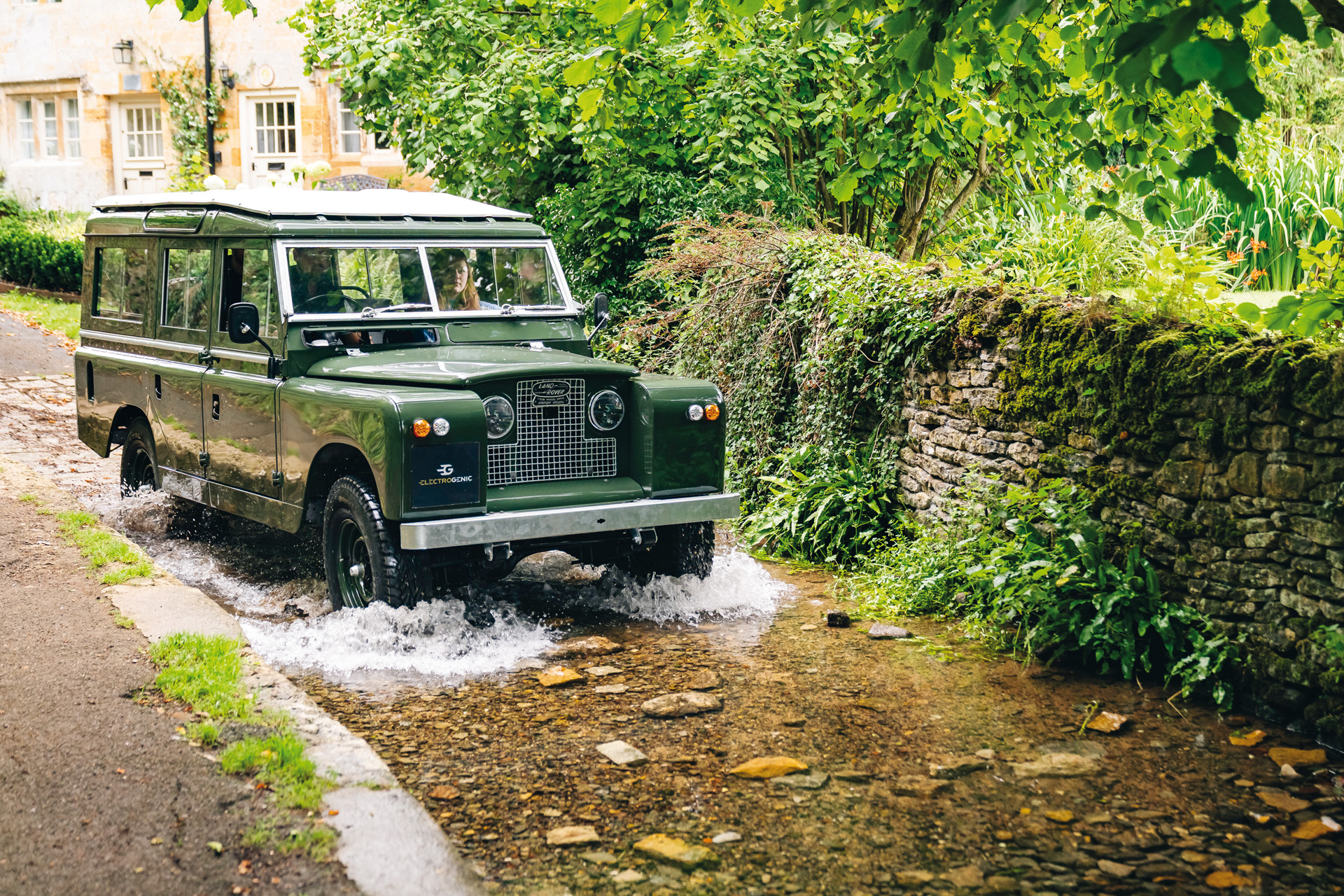 Classic Land Rover converted by Electrogenic entering a stream
