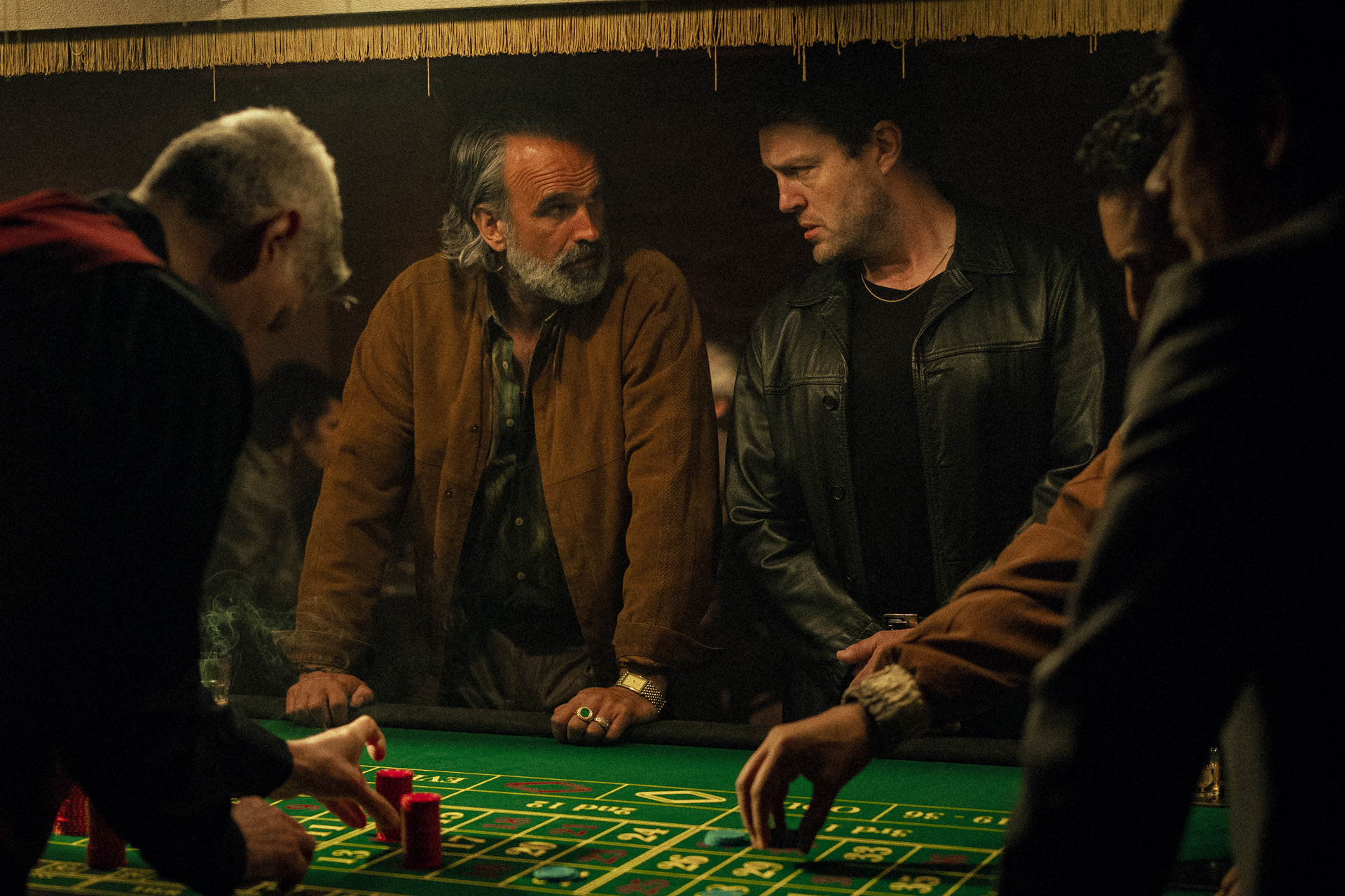 Gerald Kyd as Mylonas, Tom Burke as Guy in Legends.