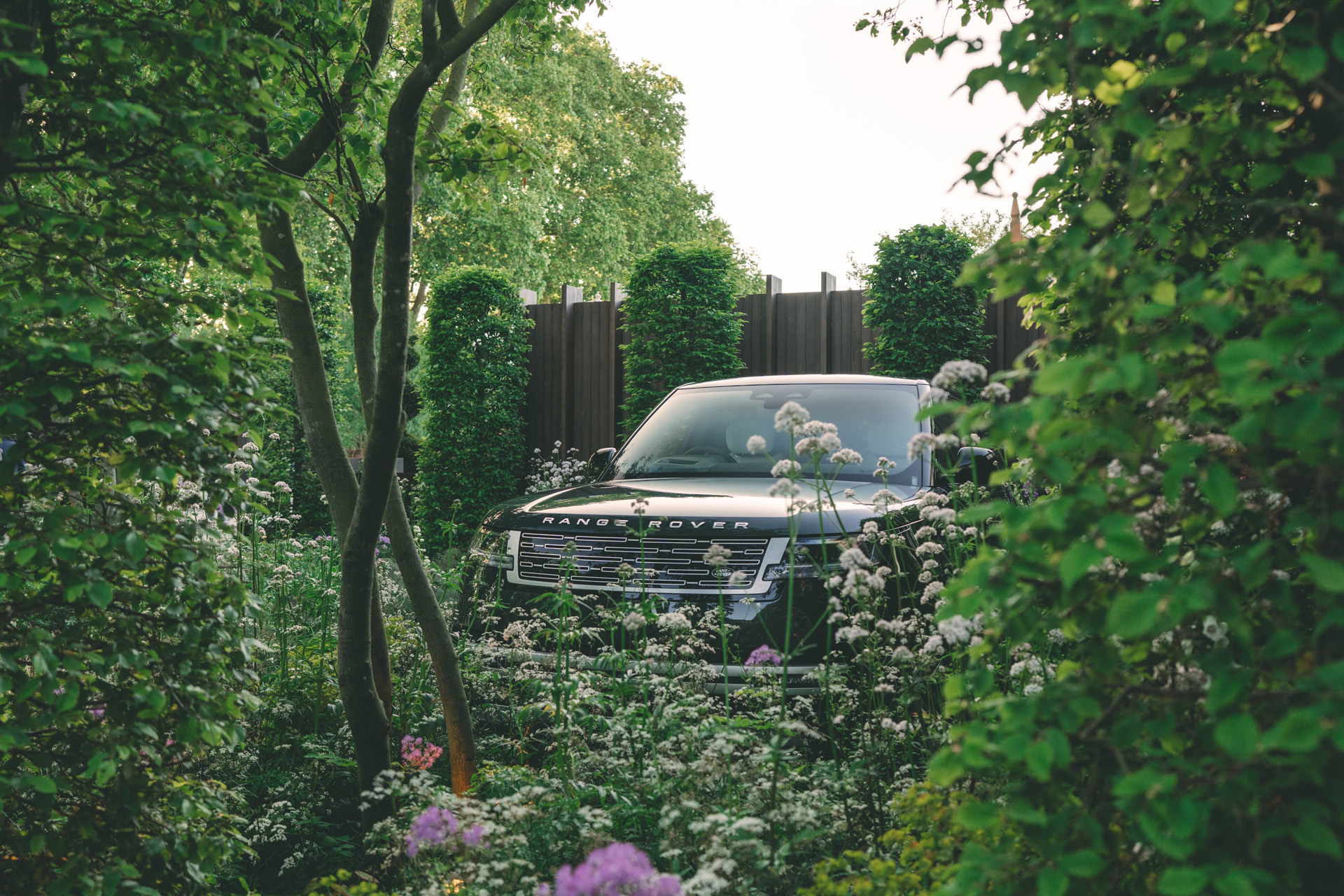 A Range Rover tucked amongst wildflowers