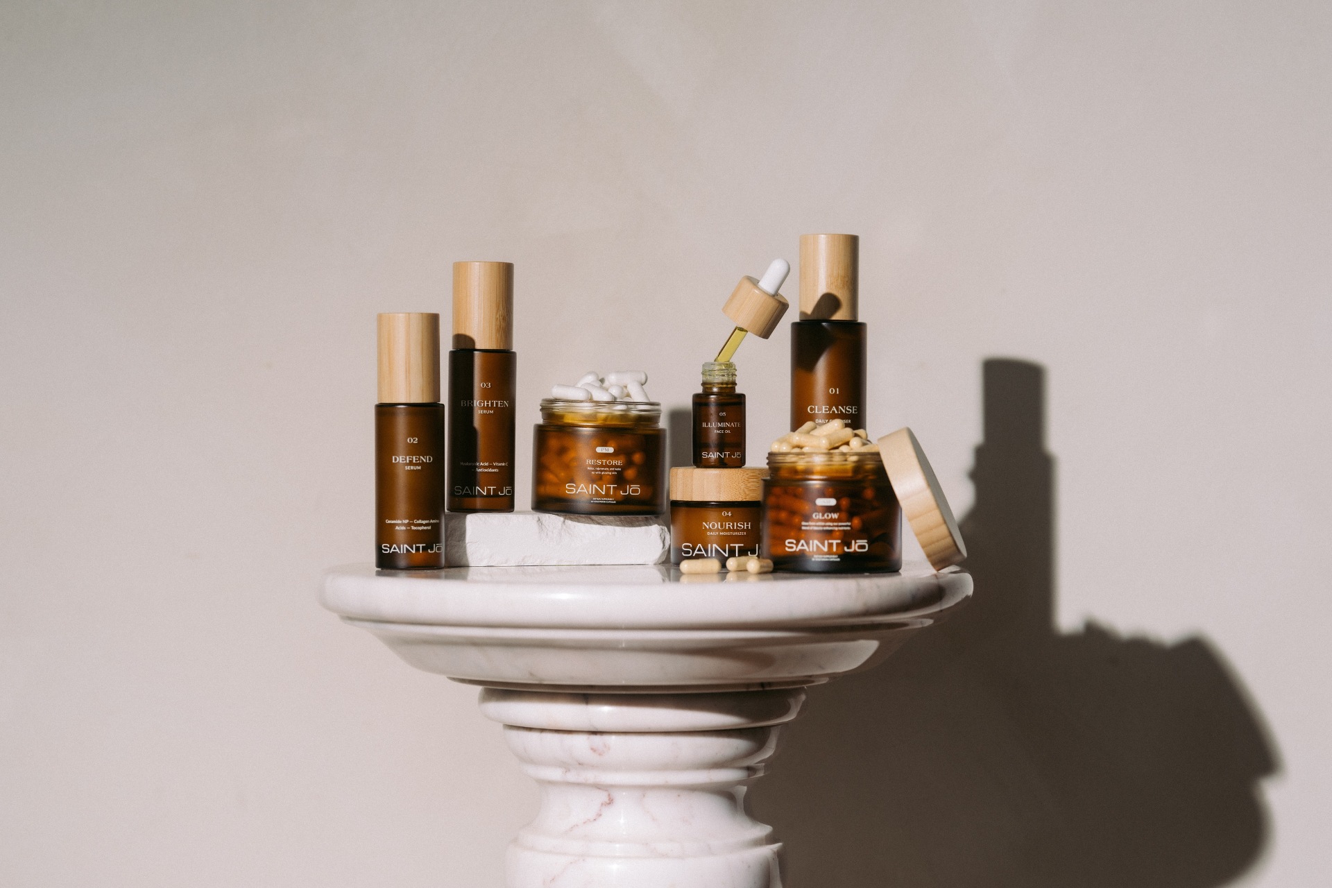The full Saint Jo skincare regime, made up of five products plus two supplement bottles