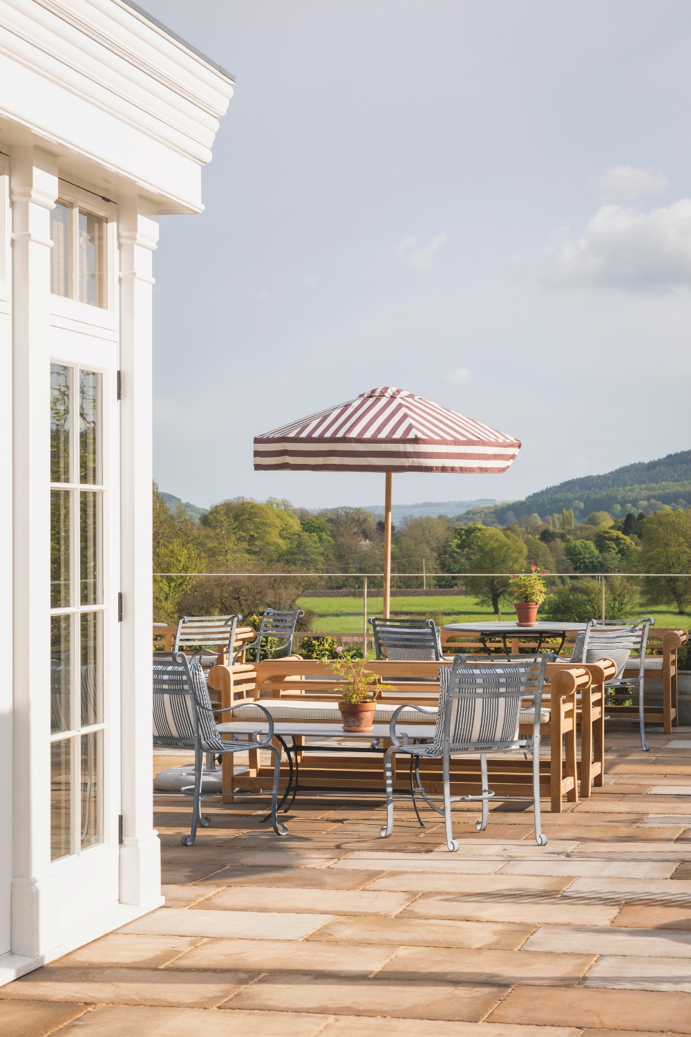 Outdoor dining space with striped umbrellas