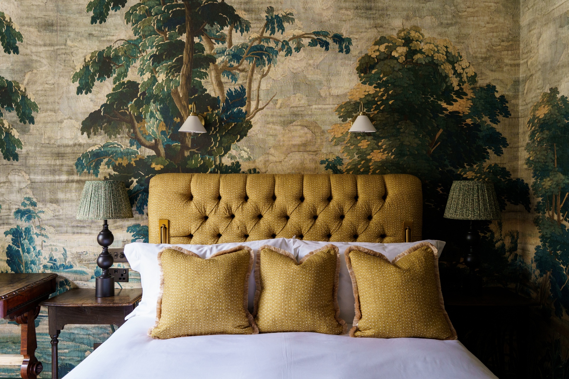 Bed against detailed wallpaper