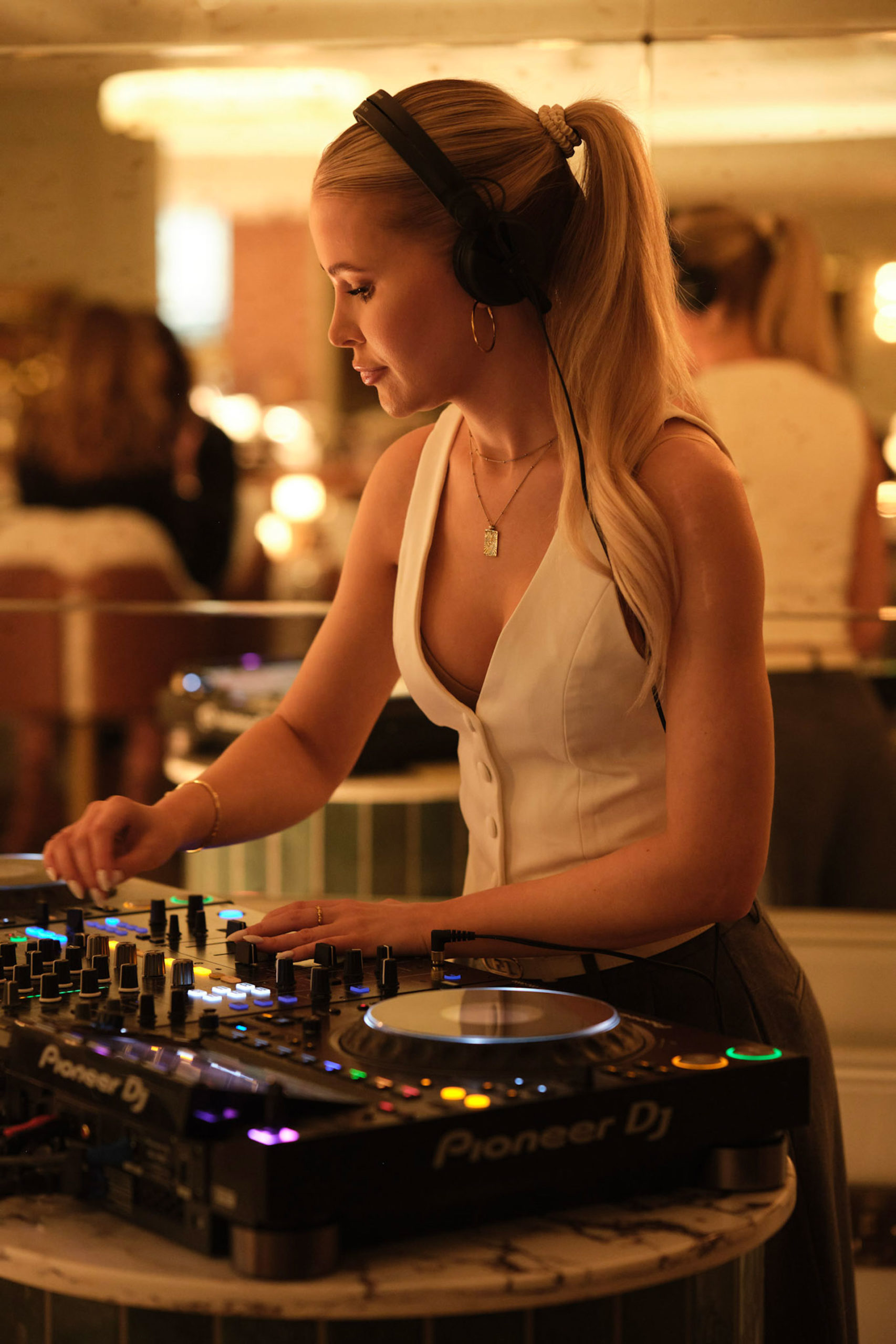 DJ wearing a white waistcoat the Fairmont Park Windsor Brasserie