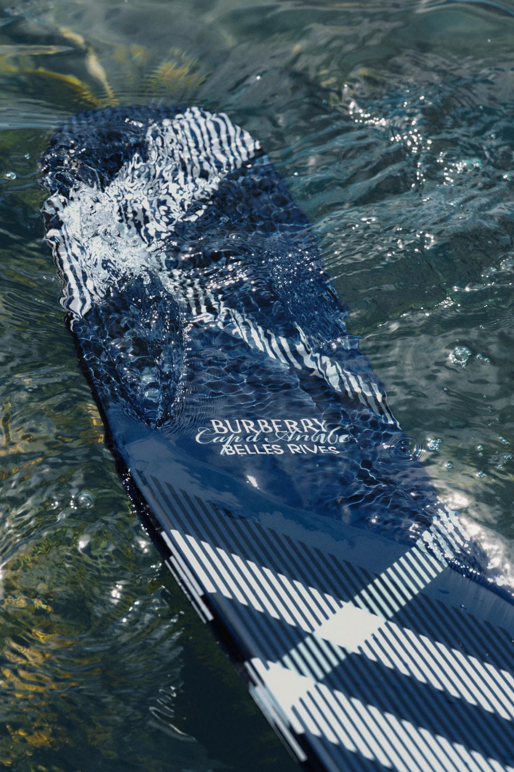 Burberry branded surf board | designer beach clubs