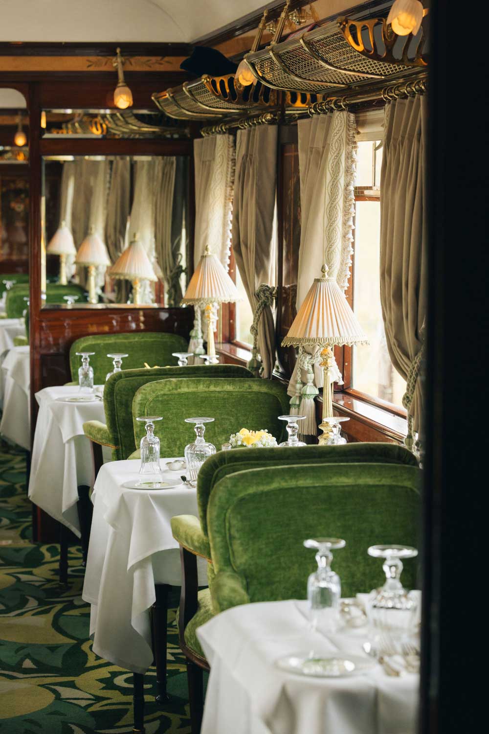 Interior of Orient Express Train with green dining chairs