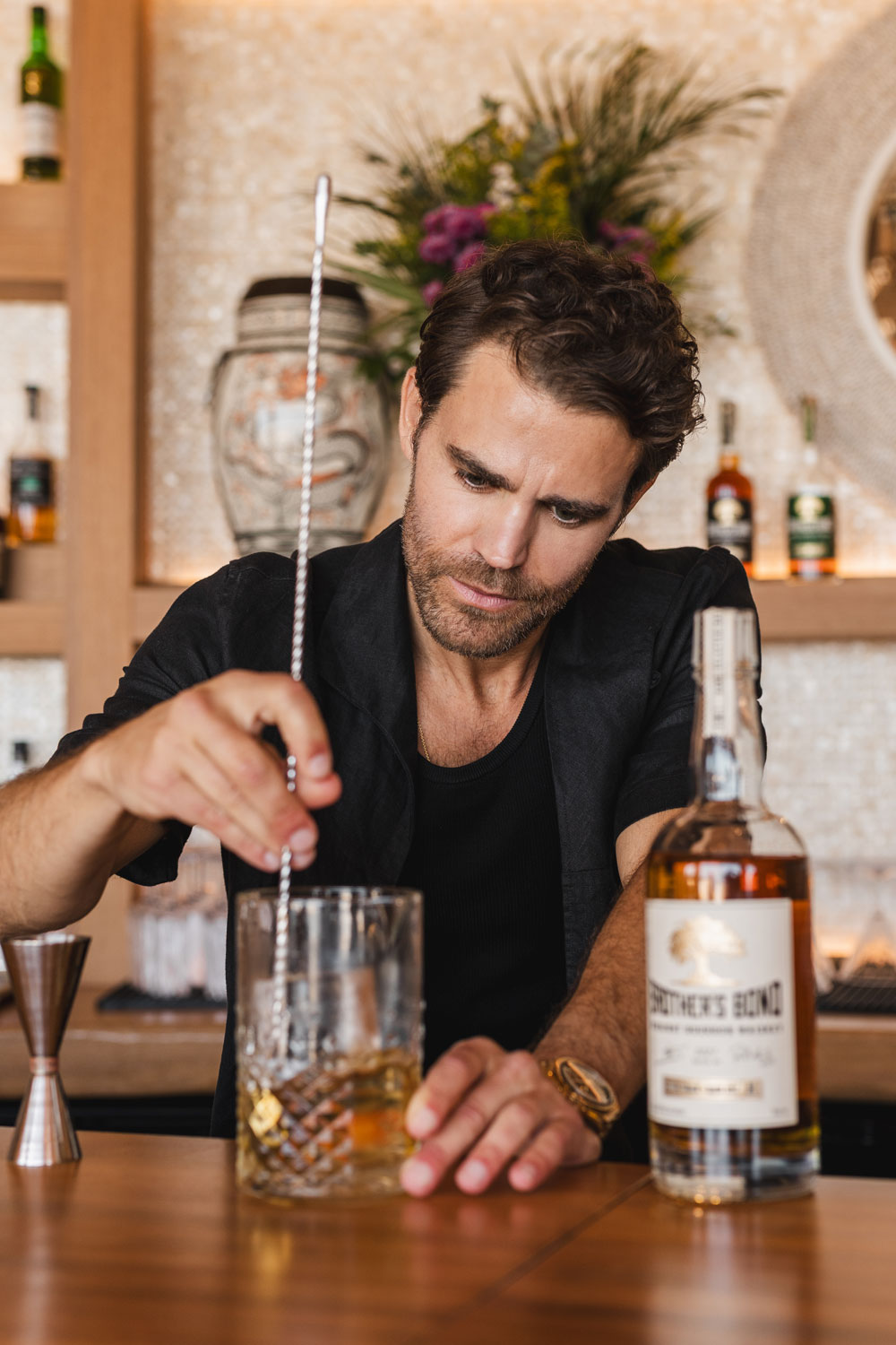Paul Wesley mixing cocktails