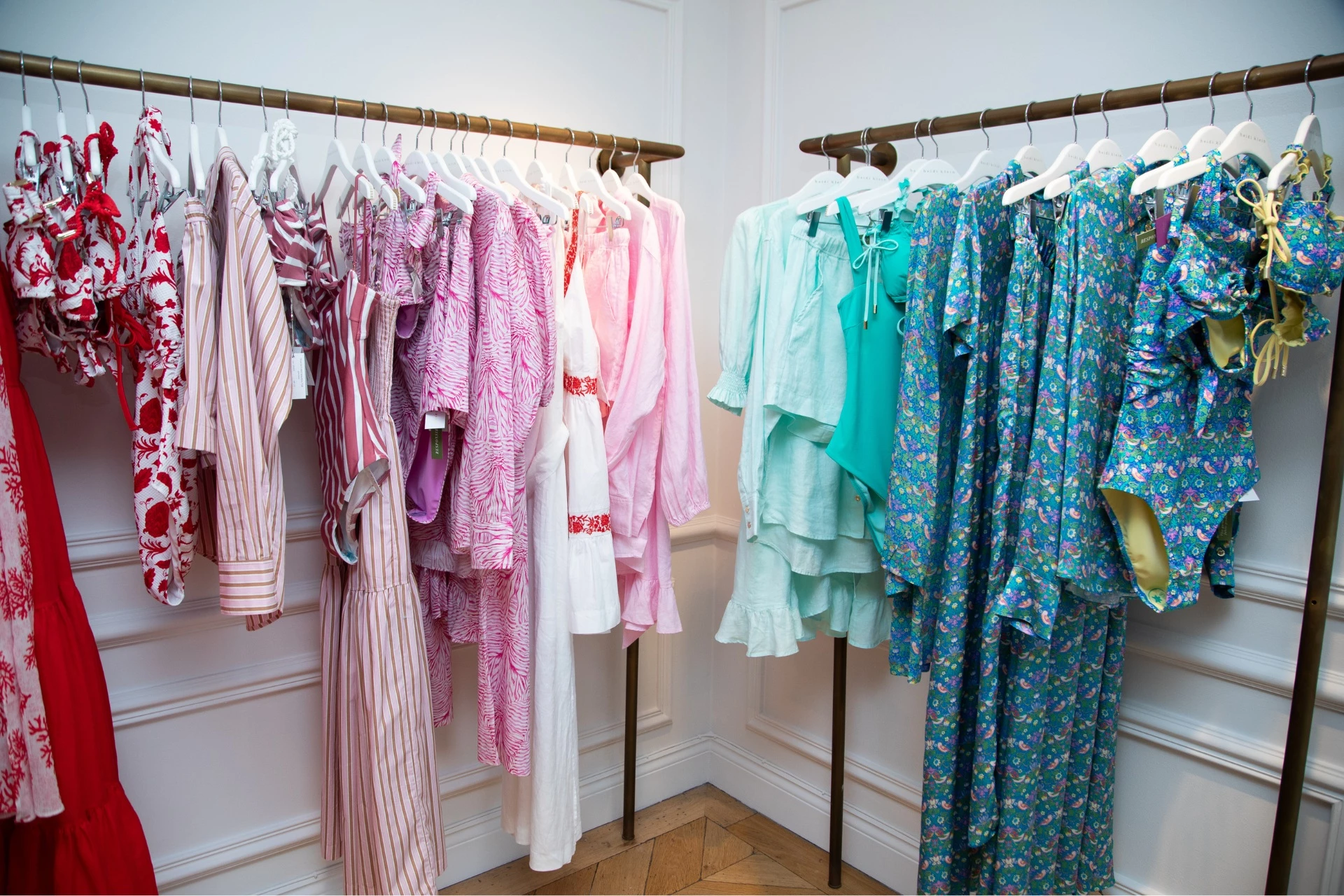 Colourful loungewear and swimwear by Heidi Klein arranged on rails