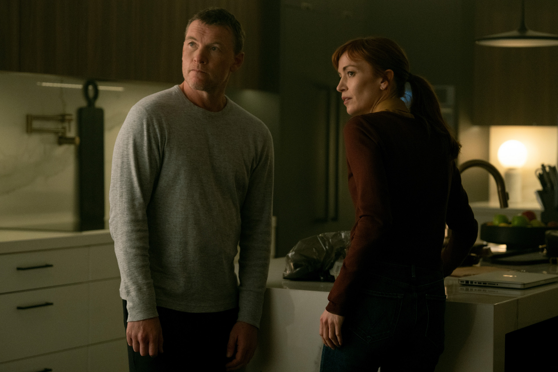 Sam Worthington as David Burroughs and Britt Lower as Rachel Mills in I Will Find You.