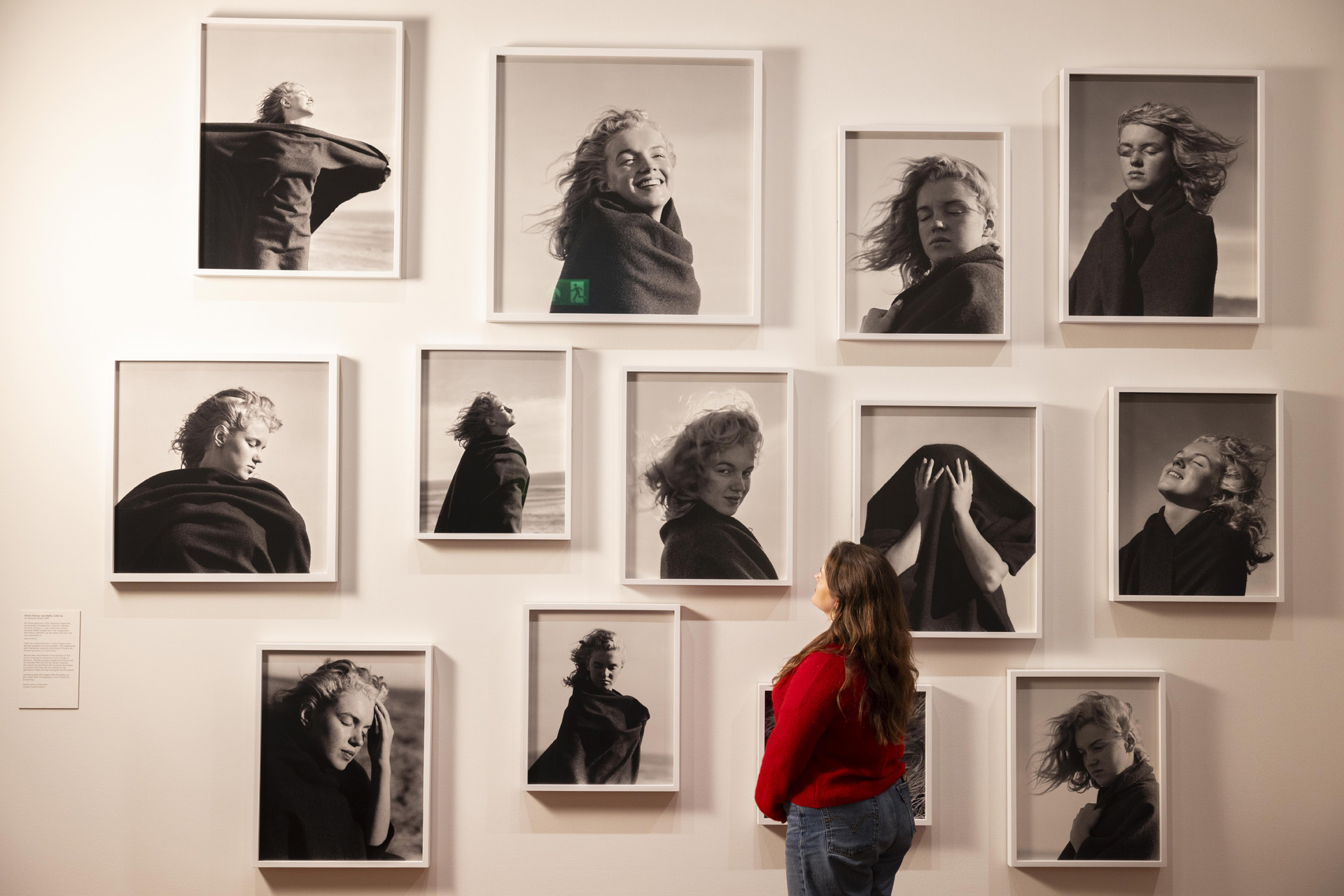 A visitor observing Marilyn Monroe, 1946, by André De Dienes, in the exhibition Marilyn Monroe: A Portrait at the National Portrait Gallery, London.