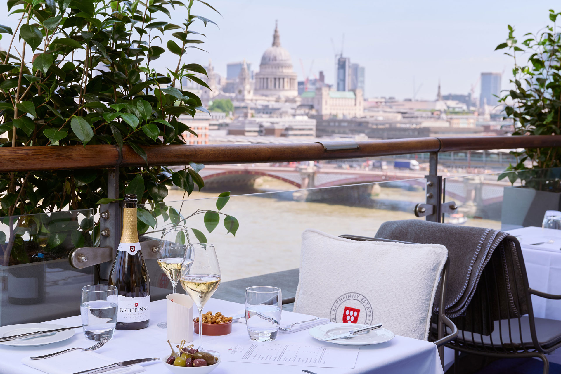 A table looking out over the river at the Rathfinny Summer Terrace at OXO Tower