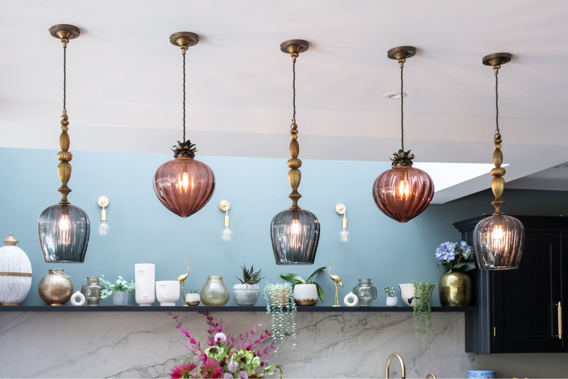 Dangling wall lights with glass lamps