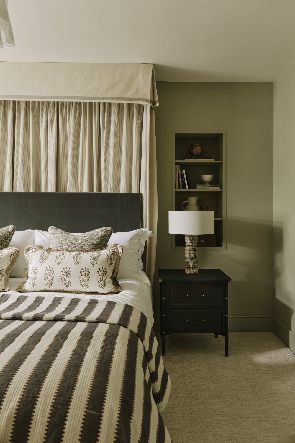 Guest bedroom with monochrome striped sheets