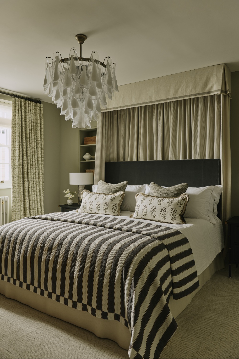 Guest bedroom with monochrome striped sheets