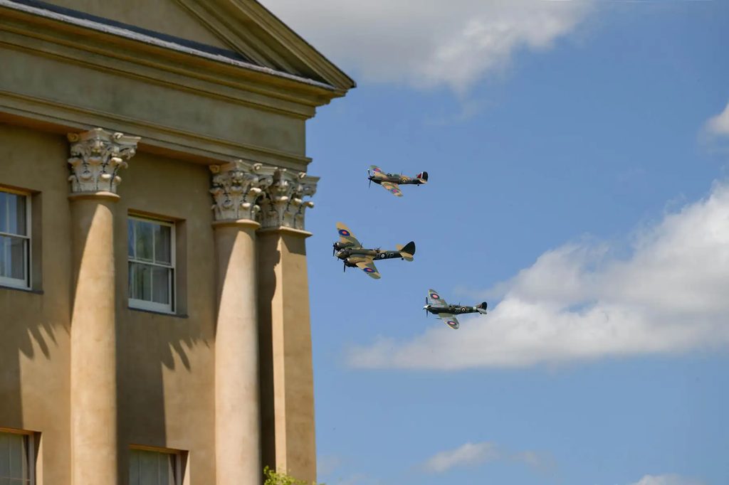 Old planes flying in a blue sky at Heveningham