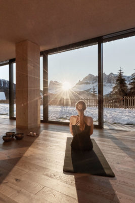 Woman doing yoga at FORESTIS