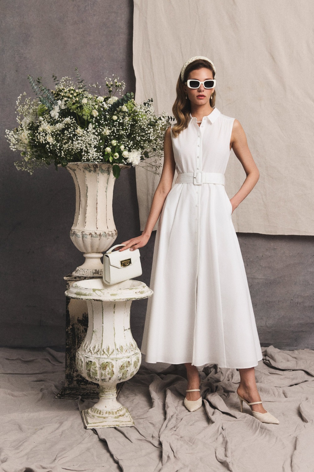 Model in white outfit from Holland Cooper