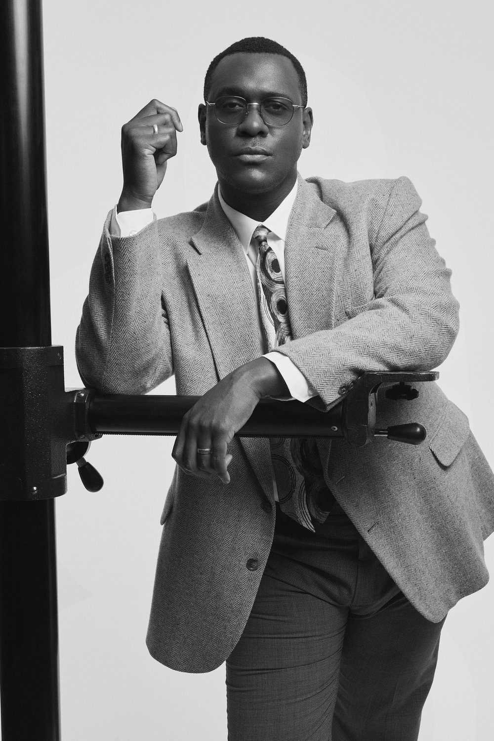 A black and white image of Abubakar Salim in a suit