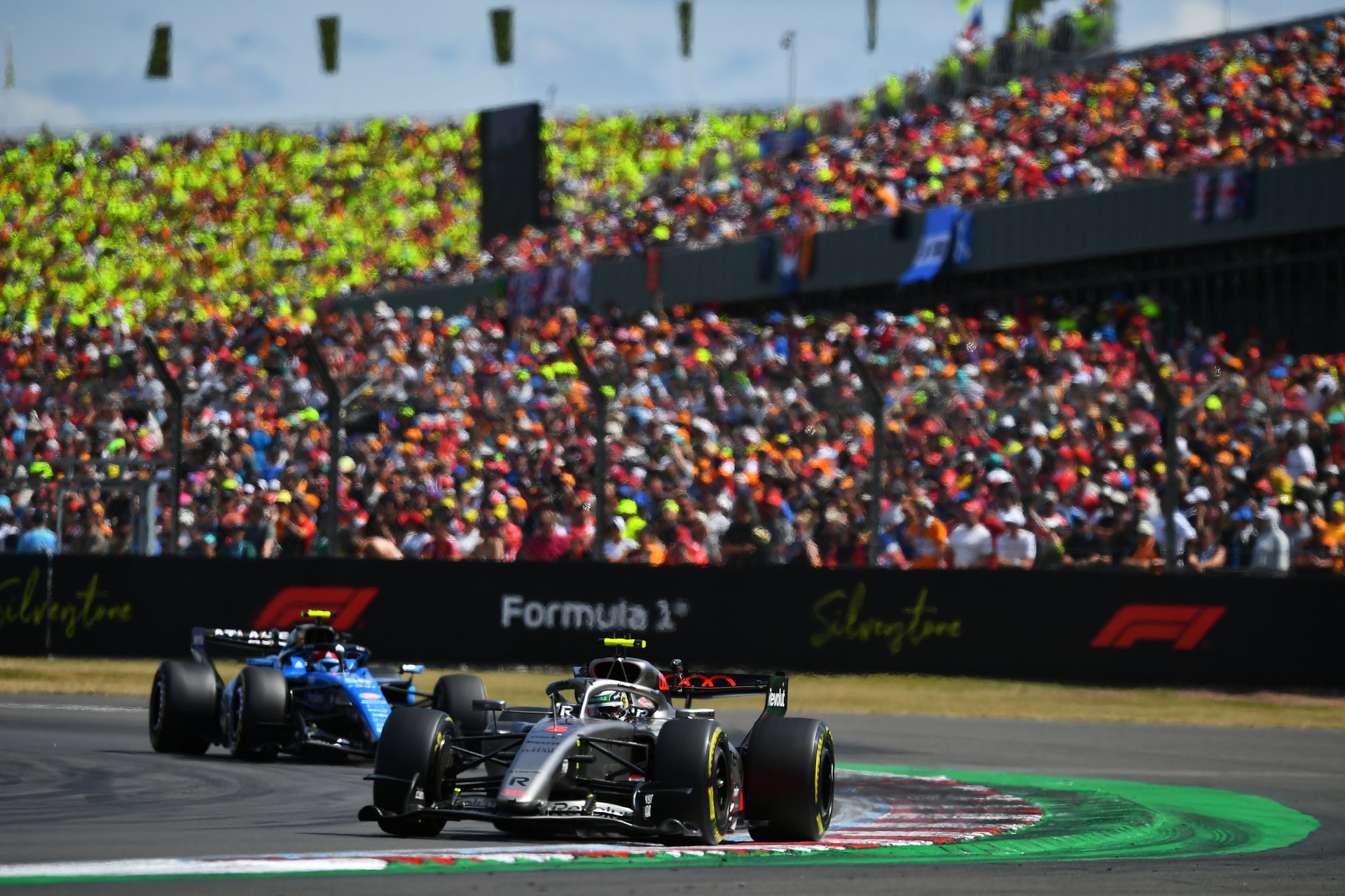 Crowds behind an F1 car at Silverstone