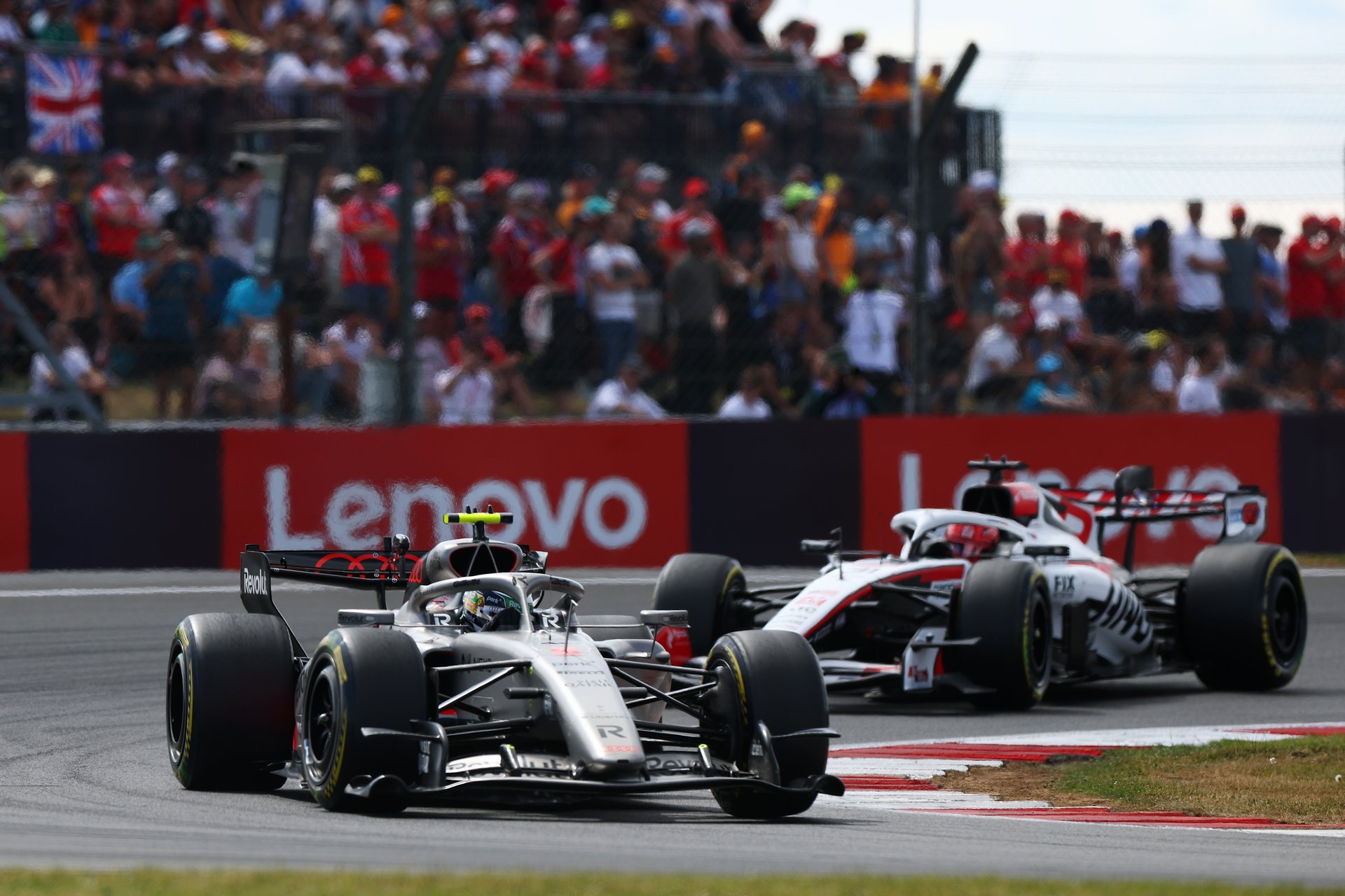Crowds behind an F1 car at Silverstone