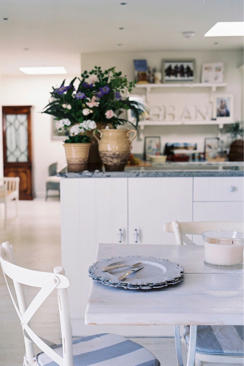 Table with view into open plan kitchen