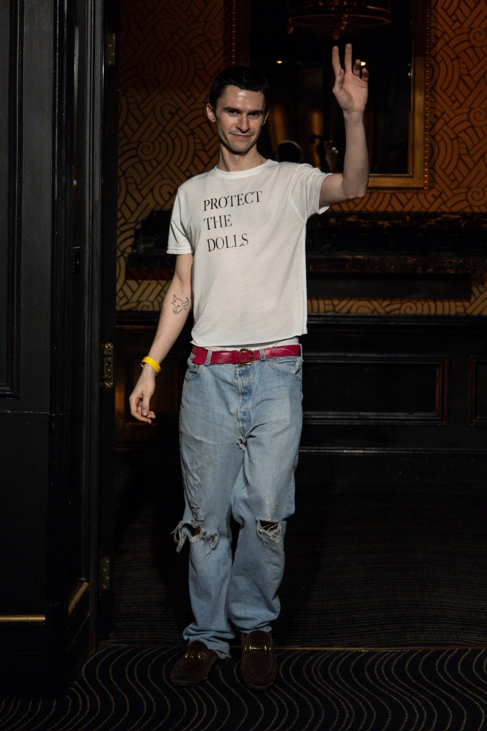 Conner Ives wearing his 'Protect the Dolls' t-shirt at his AW25 London Fashion Week show