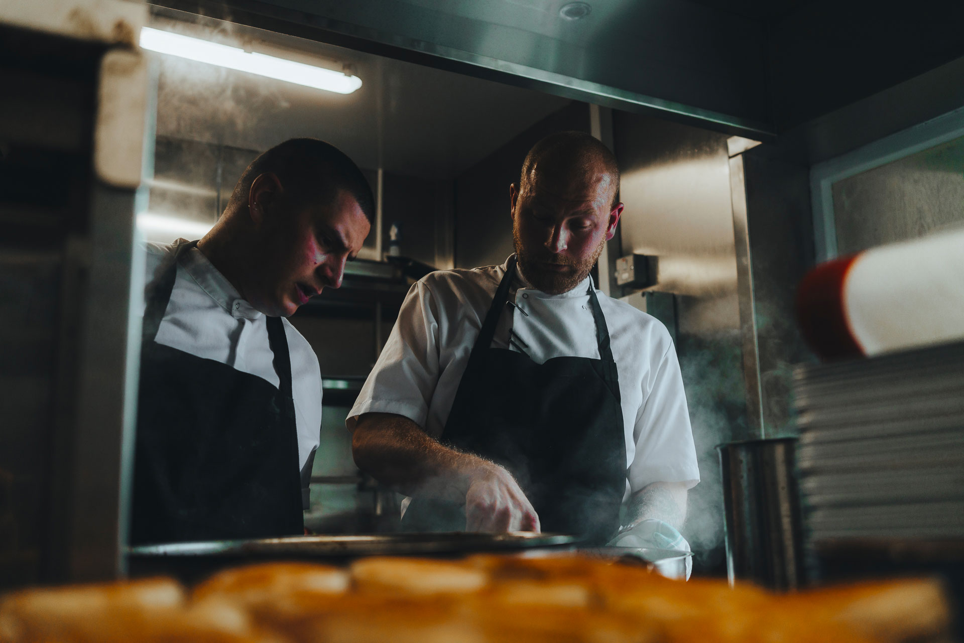 Chefs cooking in the kitchen at the George in Graveley