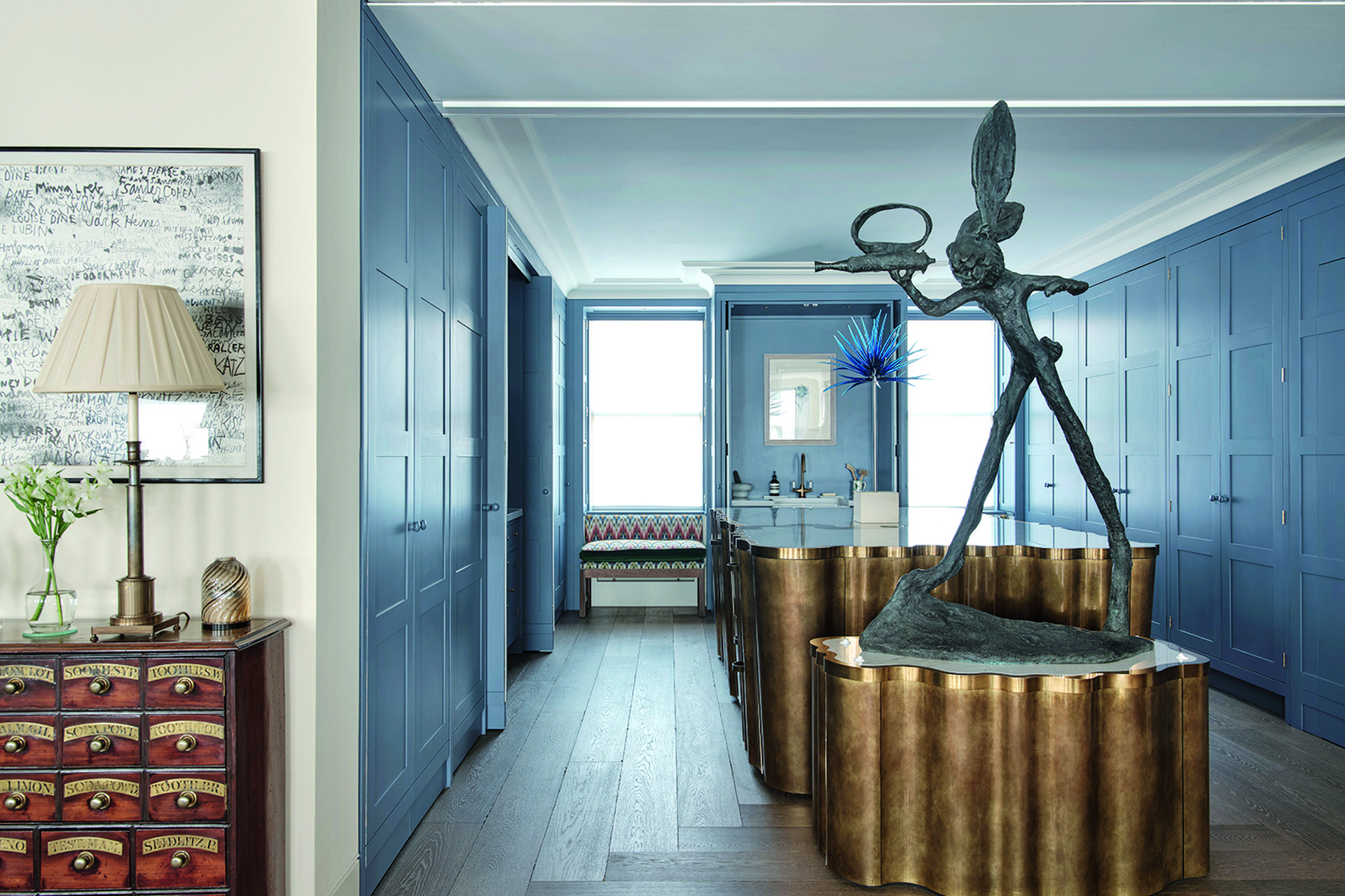 A brass-wrapped kitchen island by Rupert Bevan