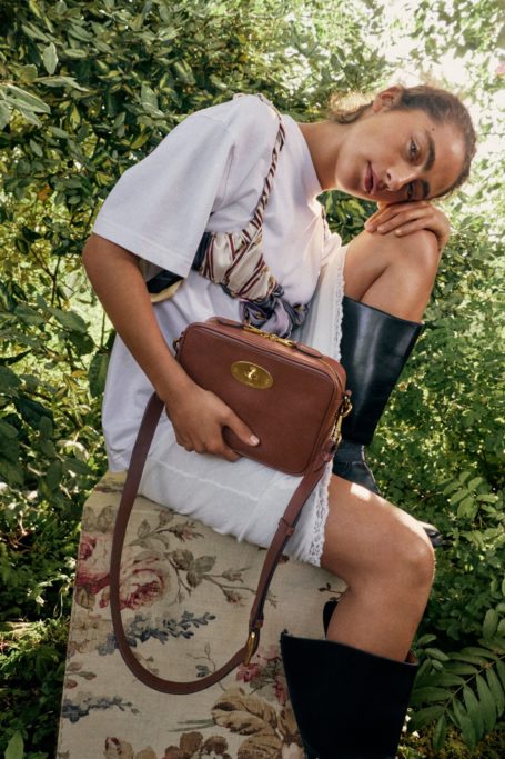 Woman holding Mulberry Darley Camera Bag