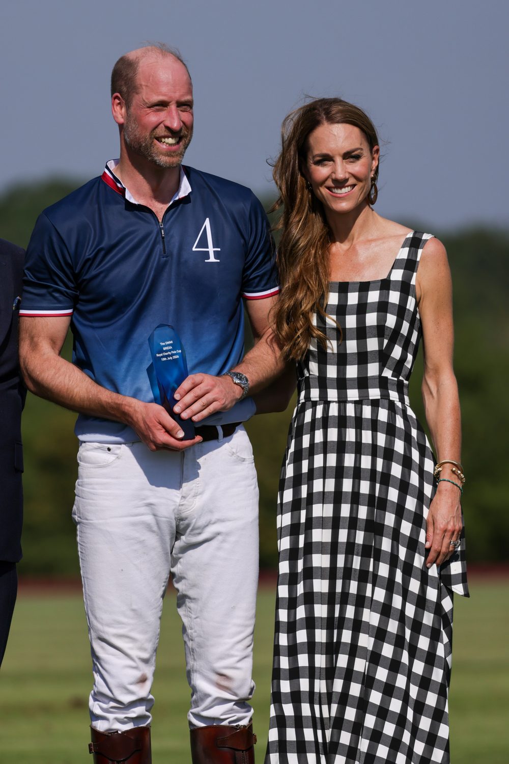 Prince William, Prince of Wales and Catherine, Princess of Wales smiling side by side at the Royal Charity Polo