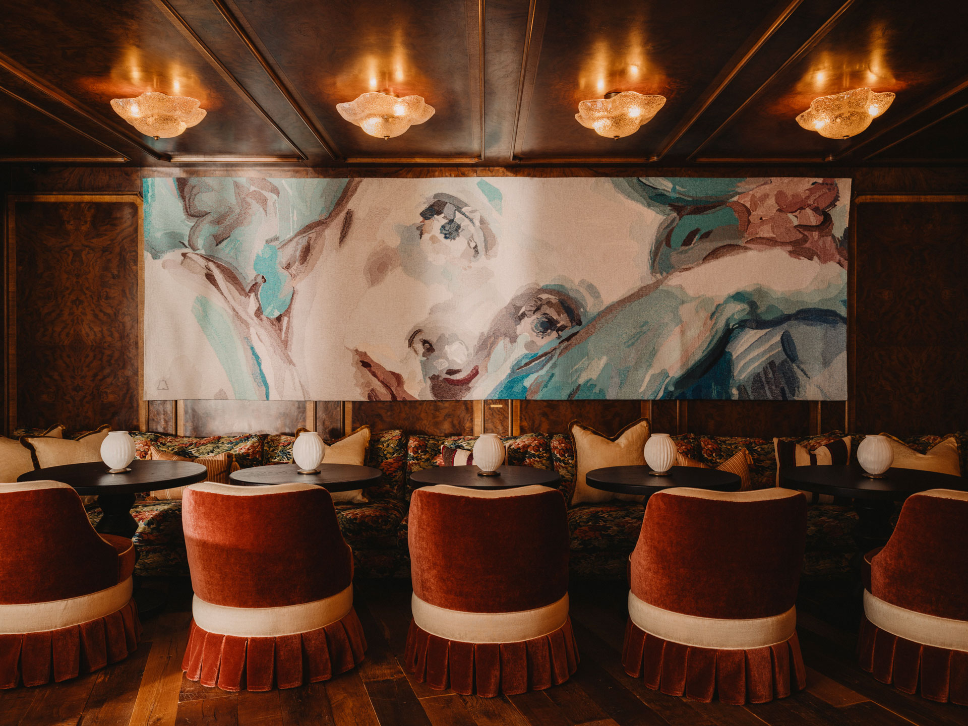 Dining table in the foreground of art at Soho Mews House