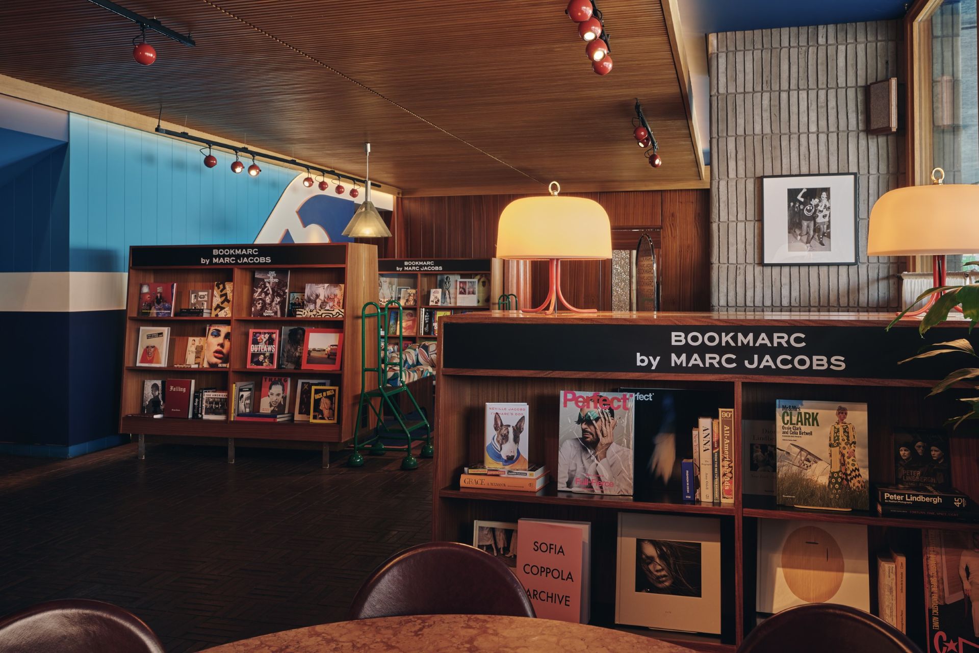 The Library inside The Standard London with low lit mushroom lamps and wooden shelves of books