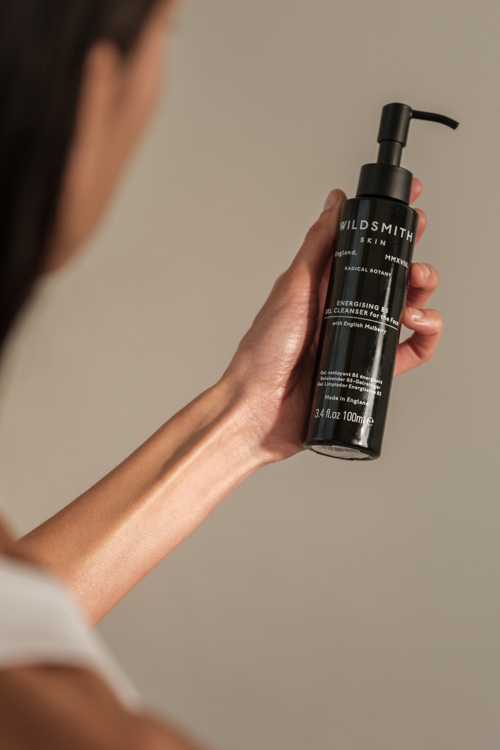 Woman holding Wildsmith Skin cleanser