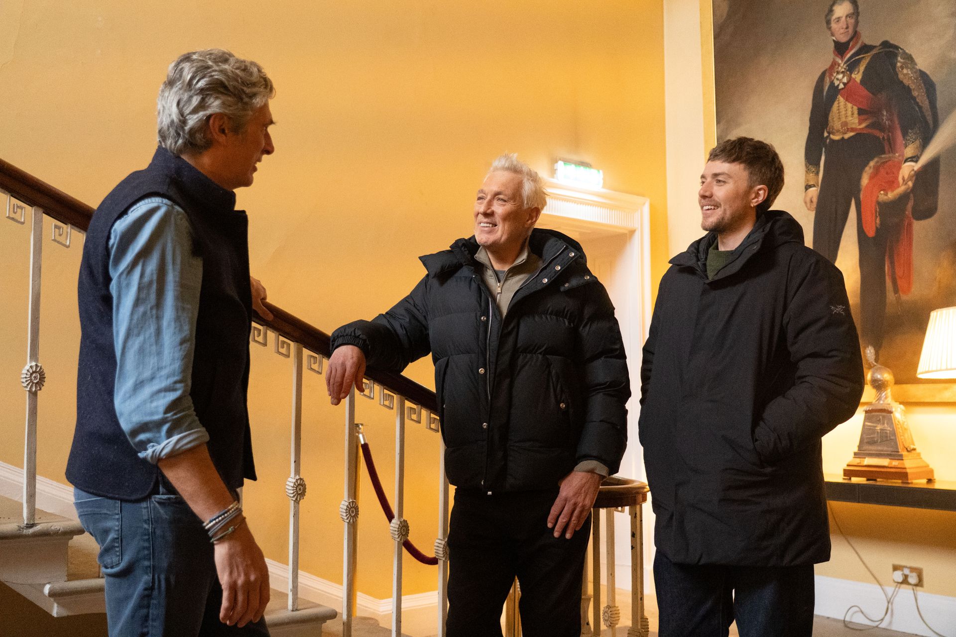 Martin and Roman meeting a tour guide in a stately home