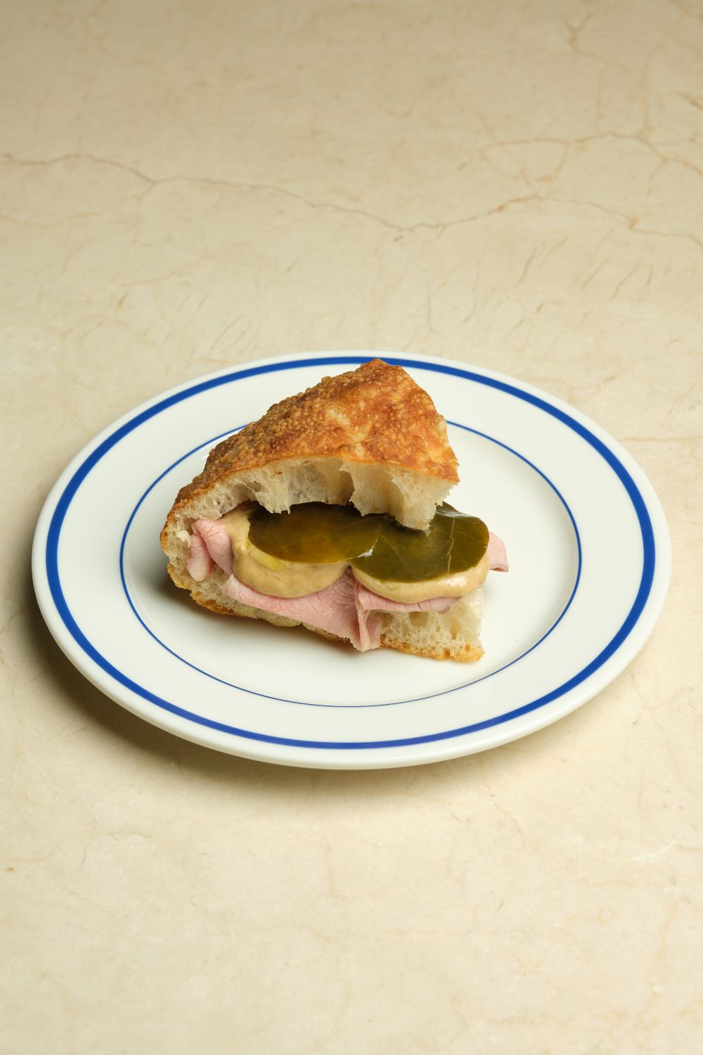A stuffed padellino on a blue rimmed plate
