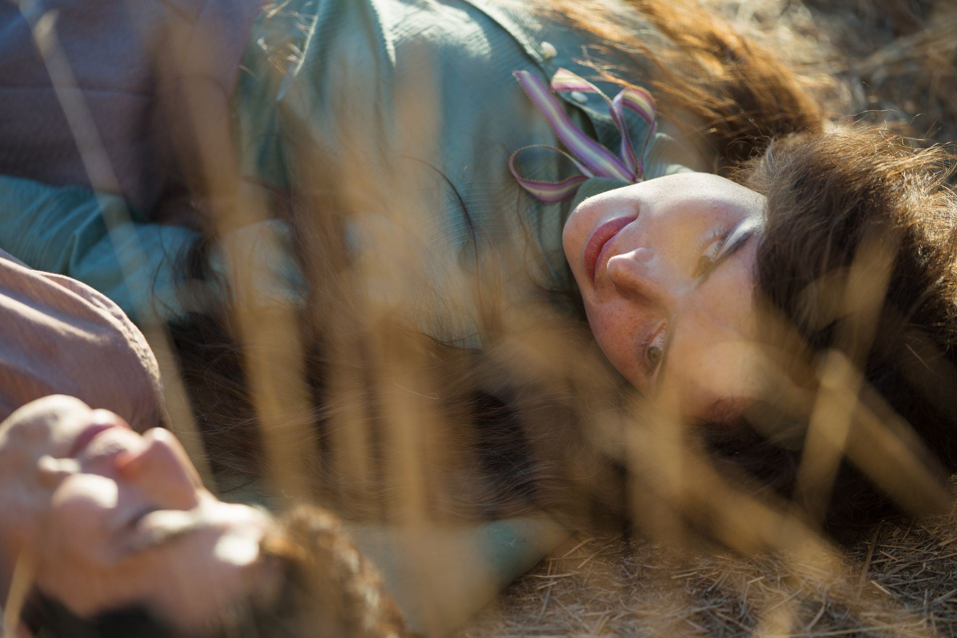 Two people lying in the grass in My Brilliant Career