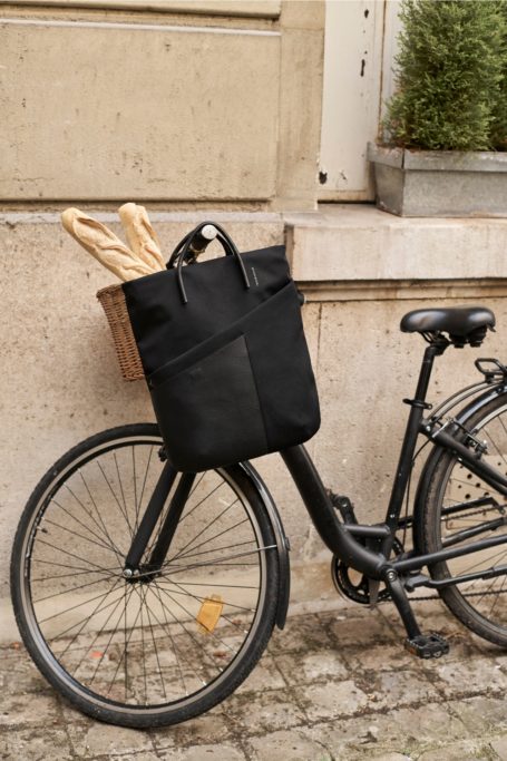 Troubadour Arc Backpack hanging from bike
