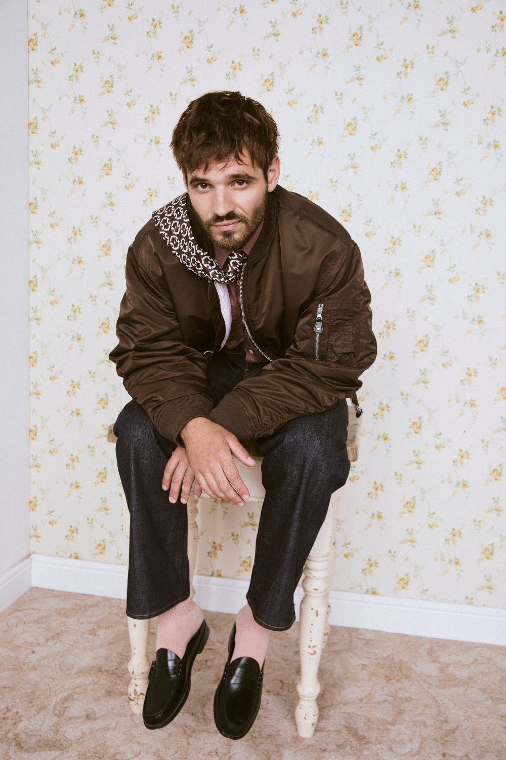 Tyler Conti sitting on a stool