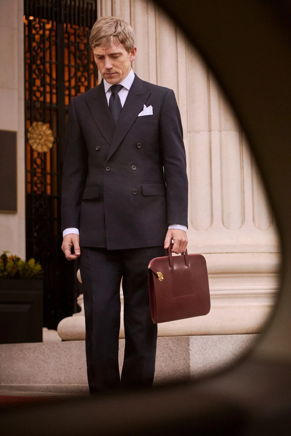 Man holding Swaine briefcase